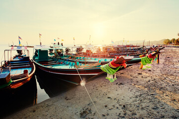 Travel by Thailand. Landscape with traditional longtail fishing boat on the sea beach.