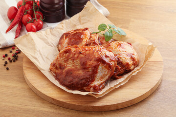 Marinated chicken leg in tomato sauce