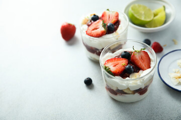 Homemade berry trifle with almond flakes