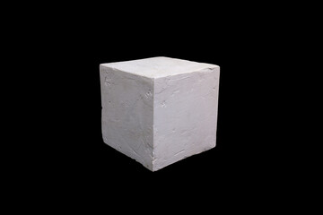 white plaster square in isolation on a black background