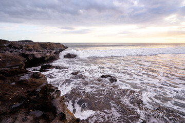 Fototapeta na wymiar Beautiful landscape with sea, stones and sunset sky.