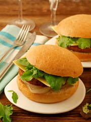 Vegan burger. Meat based on soy and wheat proteins. Cheese based on coconut oil.