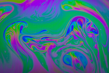 Fototapeta na wymiar Defocused blurred abstract trendy neon colored psychedelic fluorescent striped background