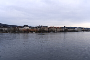 City of Zürich with lake Zürich in the foreground on a cloudy winter day. Photo taken February 3rd, 2022, Zurich, Switzerland.