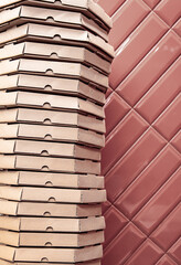 Close-up of stacks with pizza cardboard boxes