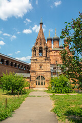 Fototapeta na wymiar Red brick Dormition Cathedral in the Krutitsy Patriarchal Metochion ecclesiastical estate built in 1600’s in Tagansky District of Moscow, Russia