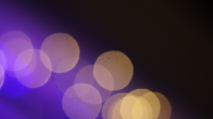Blurred defocused bokeh overlay effect. Dark abstract background Copy space wallpaper or use screen mode to add beautiful texture to your photo.