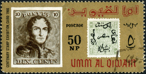 UMM AL QIWAIN - CIRCA 1966: A stamp printed in United Arab Emirates devoted to the philately...