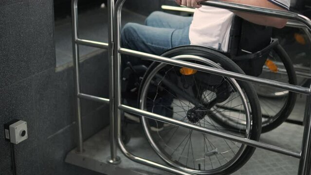 Special elevator for the person with a physical disabilities. A man in a wheelchair uses a special elevator