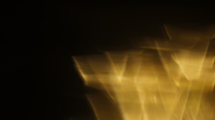 Golden bokeh crystal abstract light rays background, shiny flare texture photo overlay optical lens prism reflection. Use screen overlay mode.