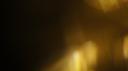 Golden bokeh crystal abstract light rays background, shiny flare texture photo overlay optical lens...