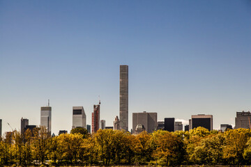 Fototapeta na wymiar Postcard from New York - Amazing view of New York City skyline from Central park lake