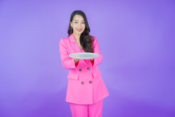 Portrait beautiful young asian woman smile with empty plate dish