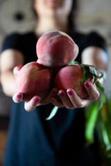 girl holding peaches