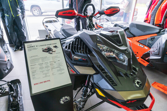 Rostov-on-Don, Russia - May 6, 2021: Close up of new BRP Ski-Doo Summit X snowmobile set out in showroom for sale