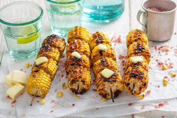Hot grilled corn cob with butter and salt.