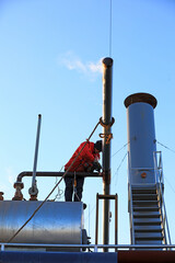 Workers are welding steam transmission pipes in a biogas power plant, North China