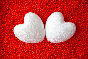 white hearts on red background