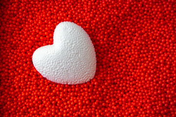 white heart on red background