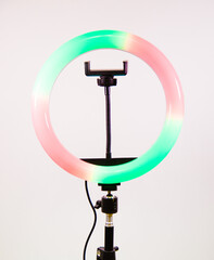 Ring lamp shines in two colors. Red and green.
