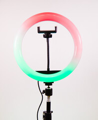 Ring lamp shines in two colors. Red and green.