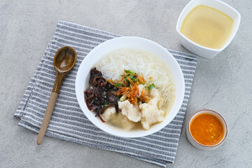 Tekwan, traditional food from Palembang, Indonesia. Made from a mixture of fish meat and tapioca, which is shaped into small balls, with vermicelli, mushrooms, spring onions, celery. Selected focus.
