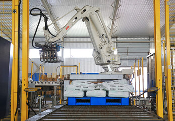 The manipulator is handling goods in a factory, North China