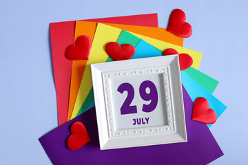 day of the month 29 July calendar . Calendar date in a white frame on a rainbow background