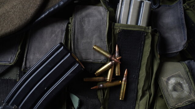 Photo of 5.56mm ammunition,  rifle ammunition in magazines, on armor vest