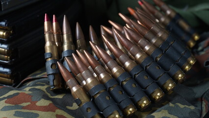 Photo of 5.56mm ammunition, machine gun bullets belt, rifle ammunition in magazines