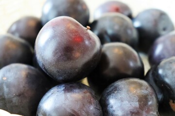 Fresh, sweet, ripe, plums. Macro Photo food fruit plums. Texture background of beautiful home plums. High quality photo.