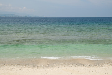 Fototapeta na wymiar Tropical exotic paradise view of Cristo Rei Beach in Dili, Timor Leste.