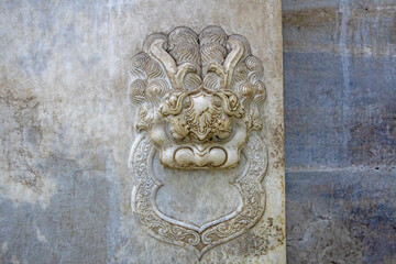 The stone lion carved in rock is on the tomb door of the emperor of the Qing Dynasty in China