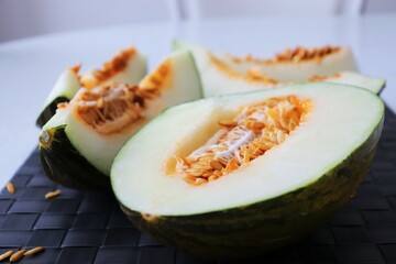 Fresh Honey melon sliced on table. Ripe honeydew melon. High quality photo