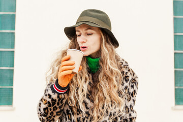 young girl in a hat with flowers and coffee