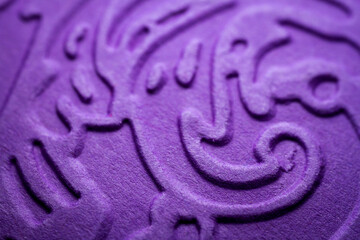 Fototapeta na wymiar Extreme macro of embossed purple paper