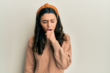 Young hispanic woman wearing casual clothes feeling unwell and coughing as symptom for cold or bronchitis. health care concept.
