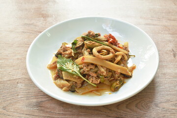 spicy stir fried bamboo shoot with mussel and squid couple mashed pork on plate
