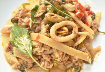 spicy stir fried bamboo shoot with mussel and squid couple mashed pork on plate