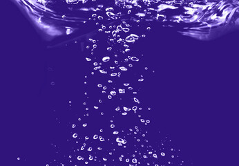 Naklejka na ściany i meble small and large air bubbles in water on a blue background, the concept of natural water resources, ecology, save nature