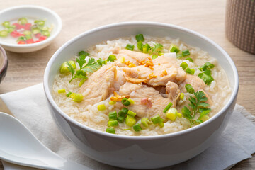 Chicken Porridge,rice soup with sliced chicken breast in white bowl.Asian breakfast style