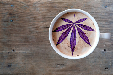 close-up of white cup with coffee cappuccino on an old brown wooden table, foam in form of silhouette of human brain, concept of mind, intellectual achievements, top view, copy space for designer
