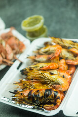 Grilled river shrimps in take home foam box