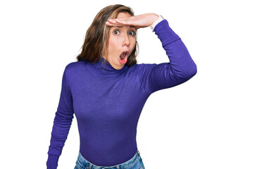 Young blonde woman wearing casual clothes surprised with hand on head for mistake, remember error....