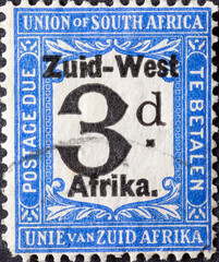 South West Africa - circa 1924: a postage stamp from South West Africa, now Namibia shows a numeral 3 d and the overprint in Dutch: South West Africa