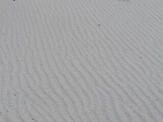 Fototapeta na wymiar Wind texture in white sand