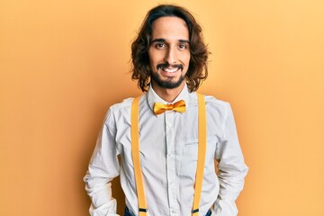 Fototapeta premium Young hispanic man wearing hipster elegant look with a happy and cool smile on face. lucky person.
