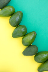 Whole avocados on color background. 