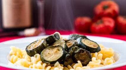 Italian food: pasta with zucchini and parmesan