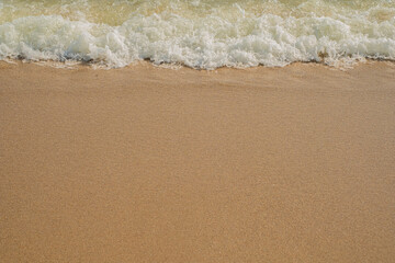 Sea waves move on sandy beach use for background,wallpaper,poster concept.